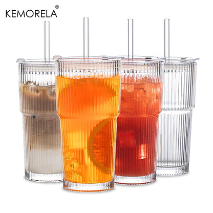 Four clear tumblers with different beverages on a white background, featuring the KEMORELA brand.