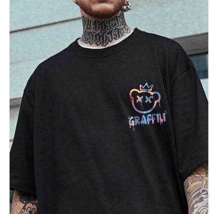 Person wearing a black t-shirt with colorful graphic design and 'Graffiti' text.