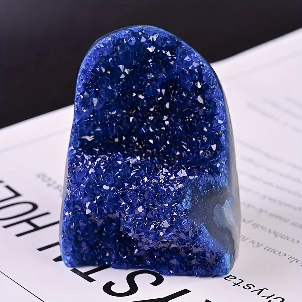 Blue crystal-like object on a printed surface