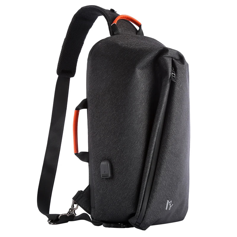 Black sling bag with orange accents on a white background