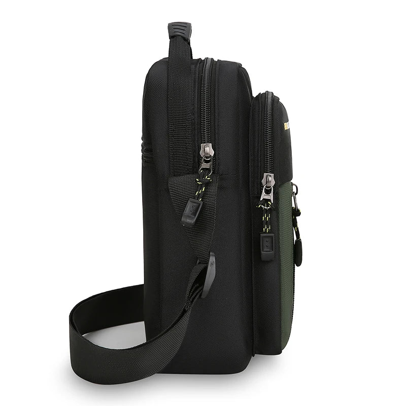 Black crossbody bag with multiple zippers on a white background