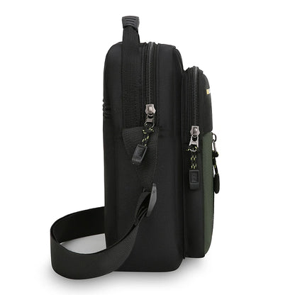 Black crossbody bag with multiple zippers on a white background