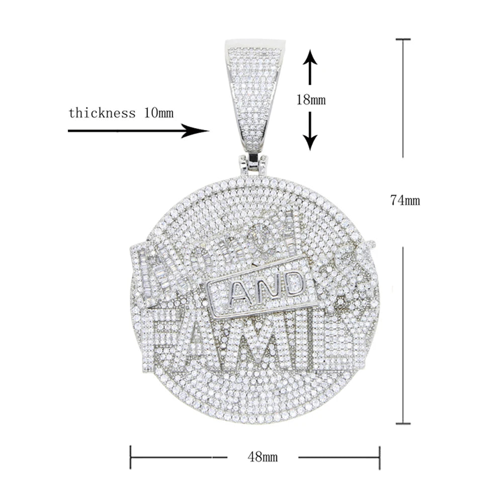 Silver pendant with 'AND TAXI' text, shown with measurements on a white background