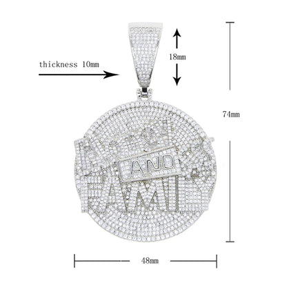 Silver pendant with 'AND TAXI' text, shown with measurements on a white background