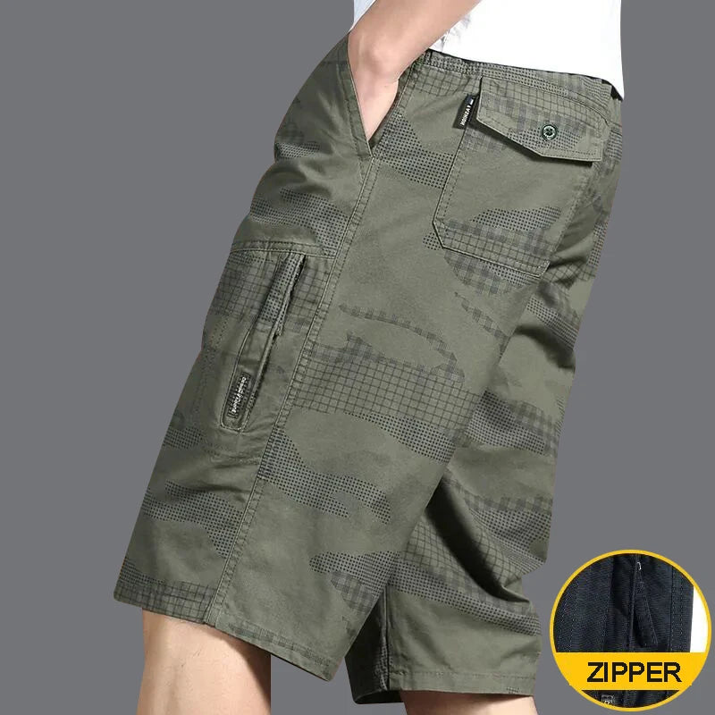 Green shorts with a zipper detail on a gray background