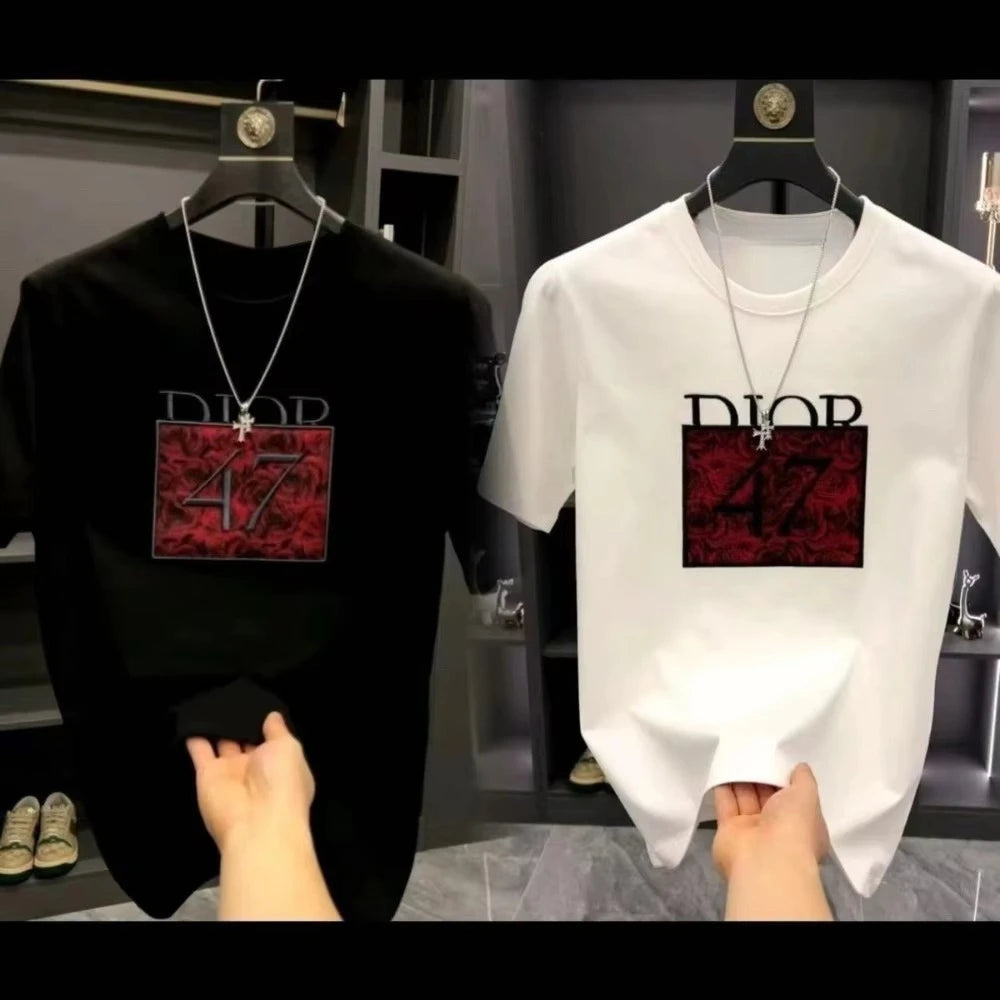 Black and white t-shirts with red and black 'Dior' logo on hangers.