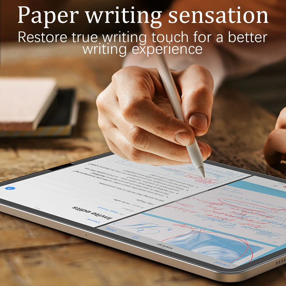 Person using a stylus on a tablet with text 'Paper writing sensation' and 'Restore true writing touch for a better writing experience'.