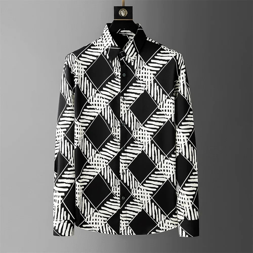 Black and white geometric patterned shirt on a gray background