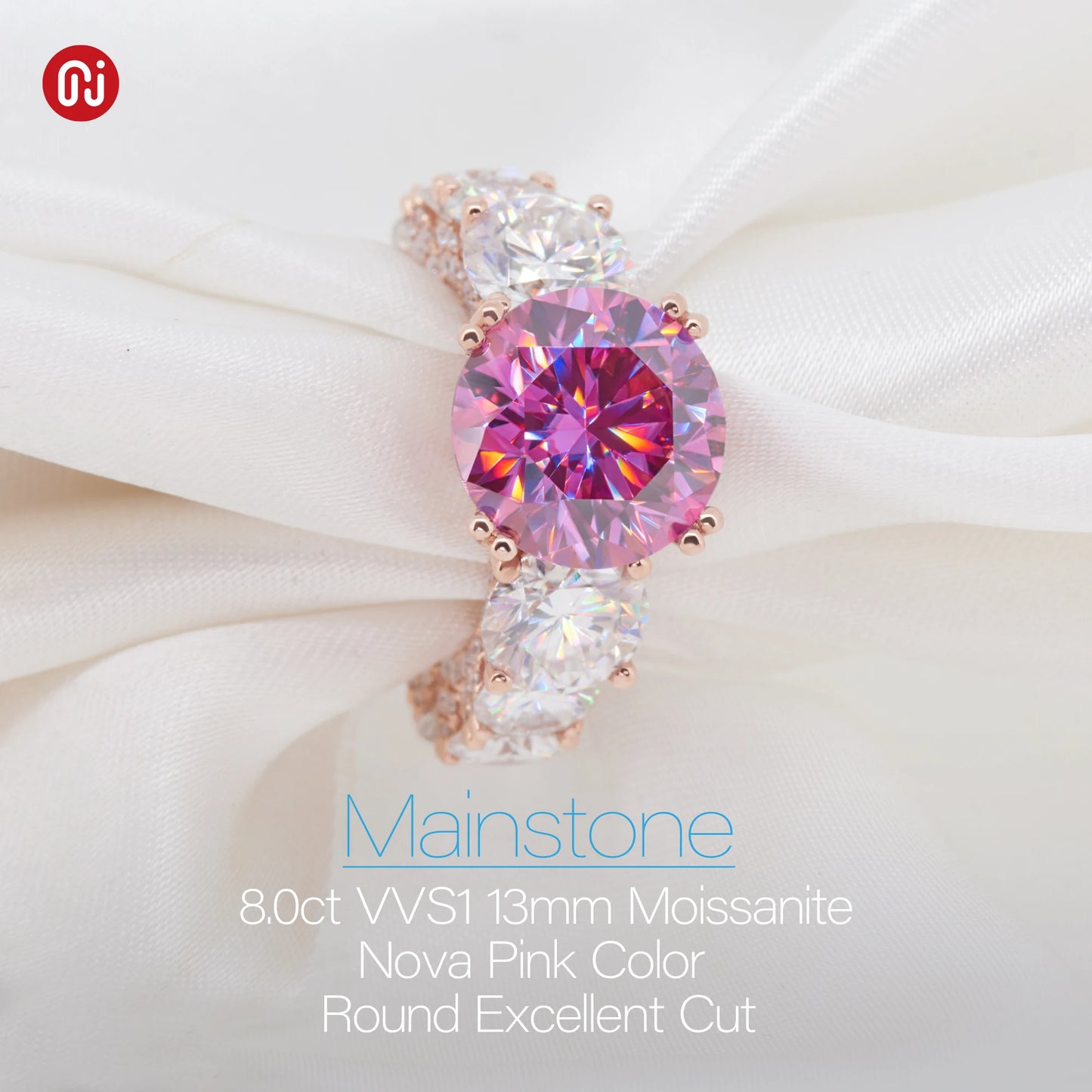 Pink gemstone earring on a white fabric background with 'Mainstone' branding.
