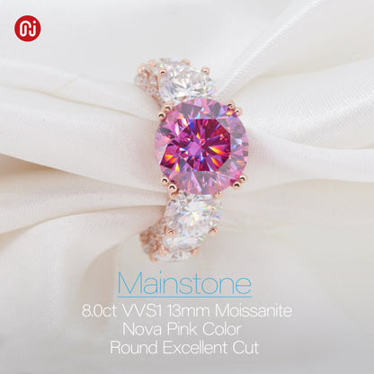Pink gemstone earring on a white fabric background with 'Mainstone' branding.