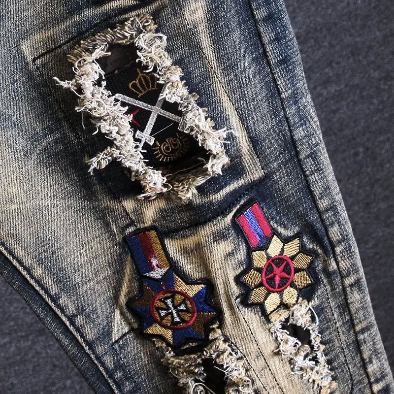Denim jacket with decorative patches and embroidery on a dark background