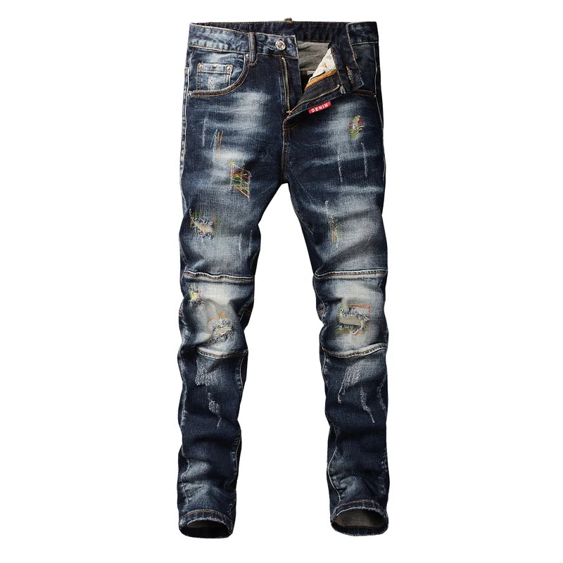 Distressed blue jeans on a white background