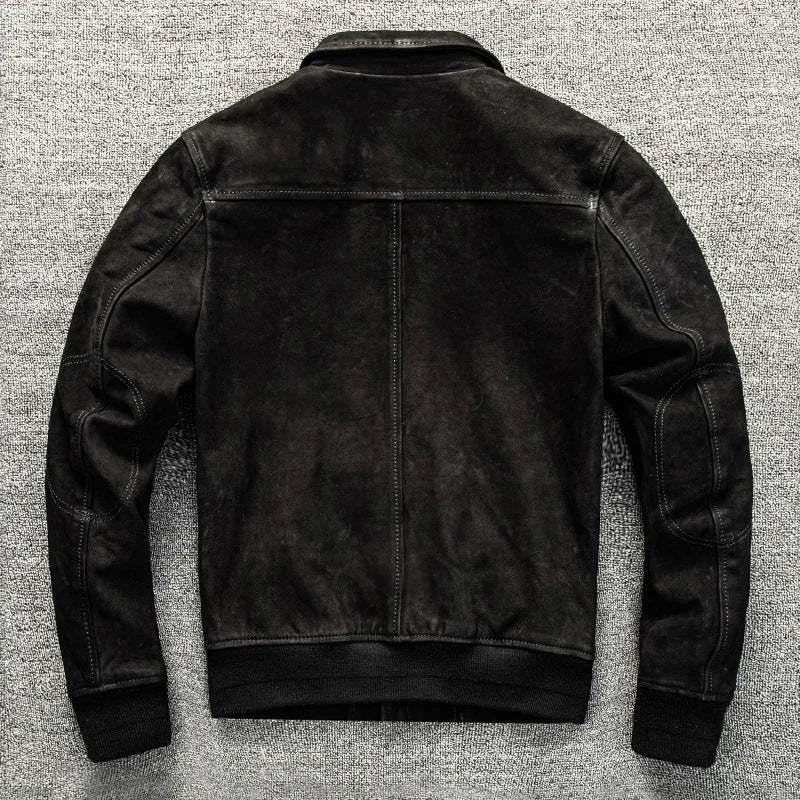 Black leather jacket on a textured gray background