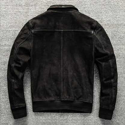Black leather jacket on a textured gray background