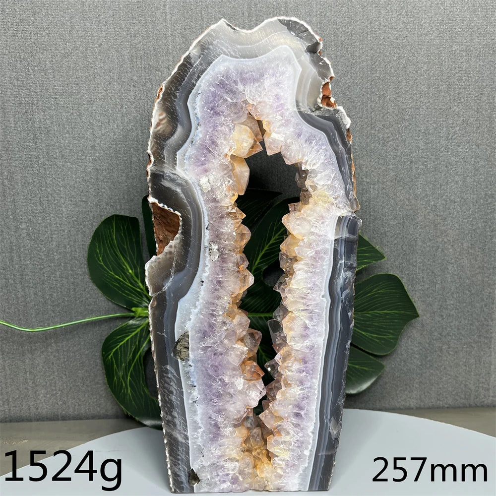 Geode crystal with a gray and white interior on a gray background
