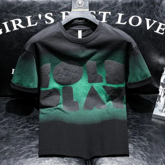 Green and black t-shirt with text on a dark background