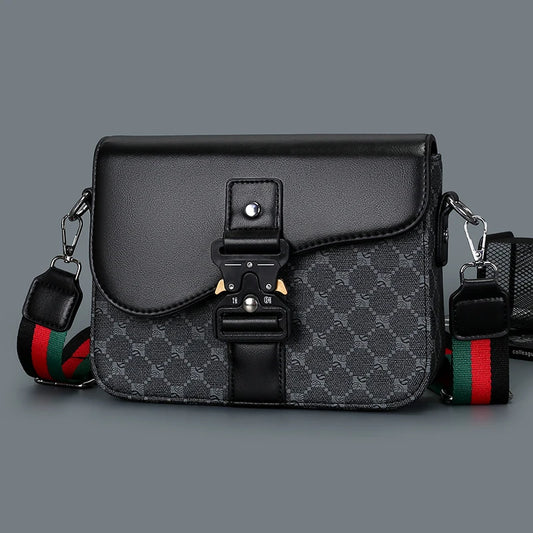 Black and gray patterned bag with a colorful strap on a gray background