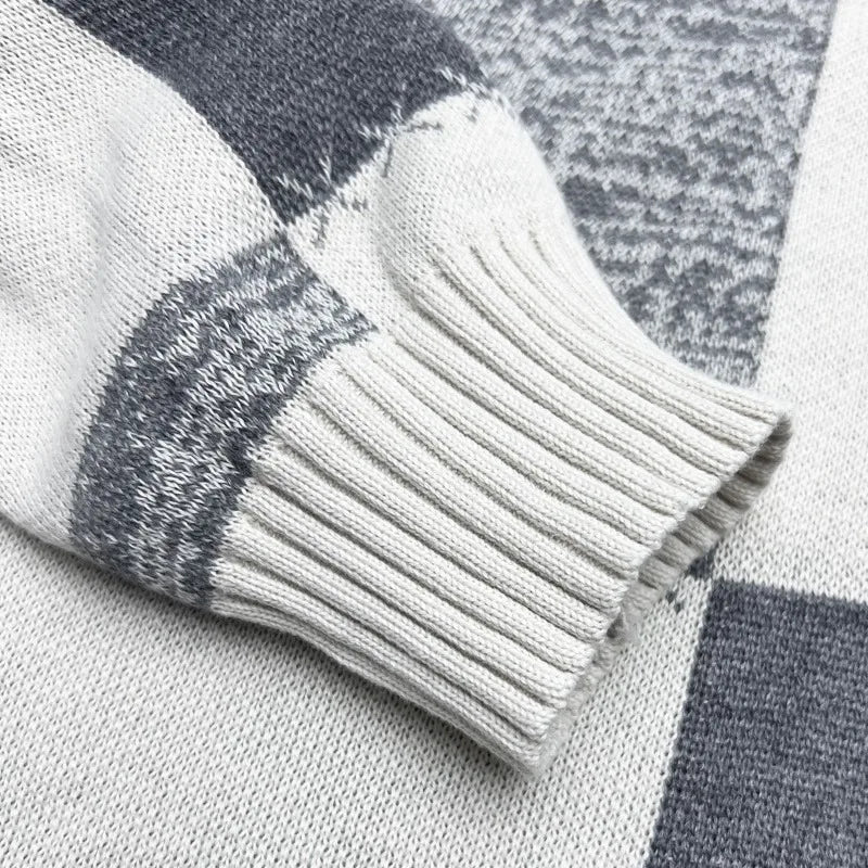 Close-up of a gray and white checkered fabric with a textured pattern.