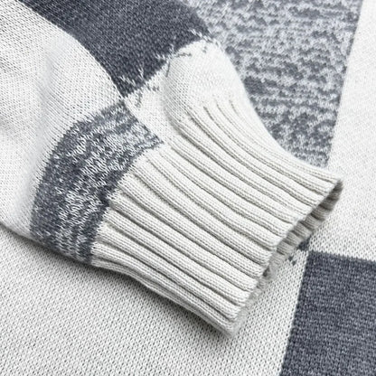 Close-up of a gray and white checkered fabric with a textured pattern.