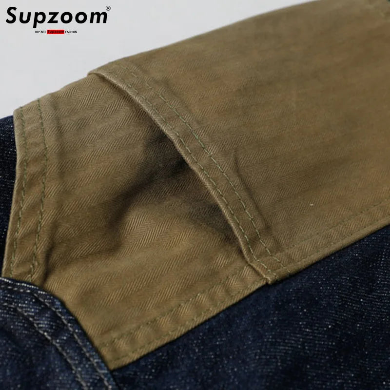 Close-up of a brown fabric patch on a denim background with 'Supzoom' branding.