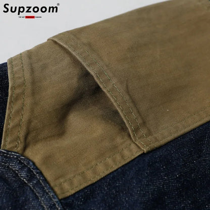 Close-up of a brown fabric patch on a denim background with 'Supzoom' branding.