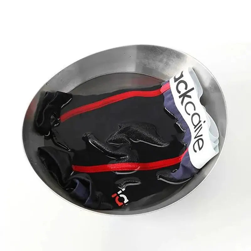 Black and red item with a visible brand logo in a metallic container on a white background