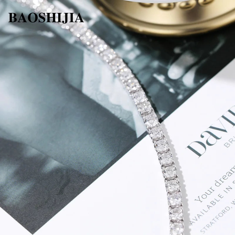Diamond bracelet on a magazine with BAOSHIJIA branding