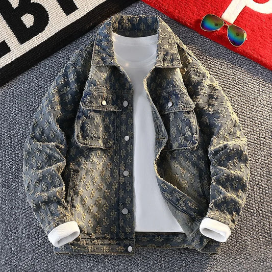 Denim jacket on a mannequin with sunglasses and a bag in the background