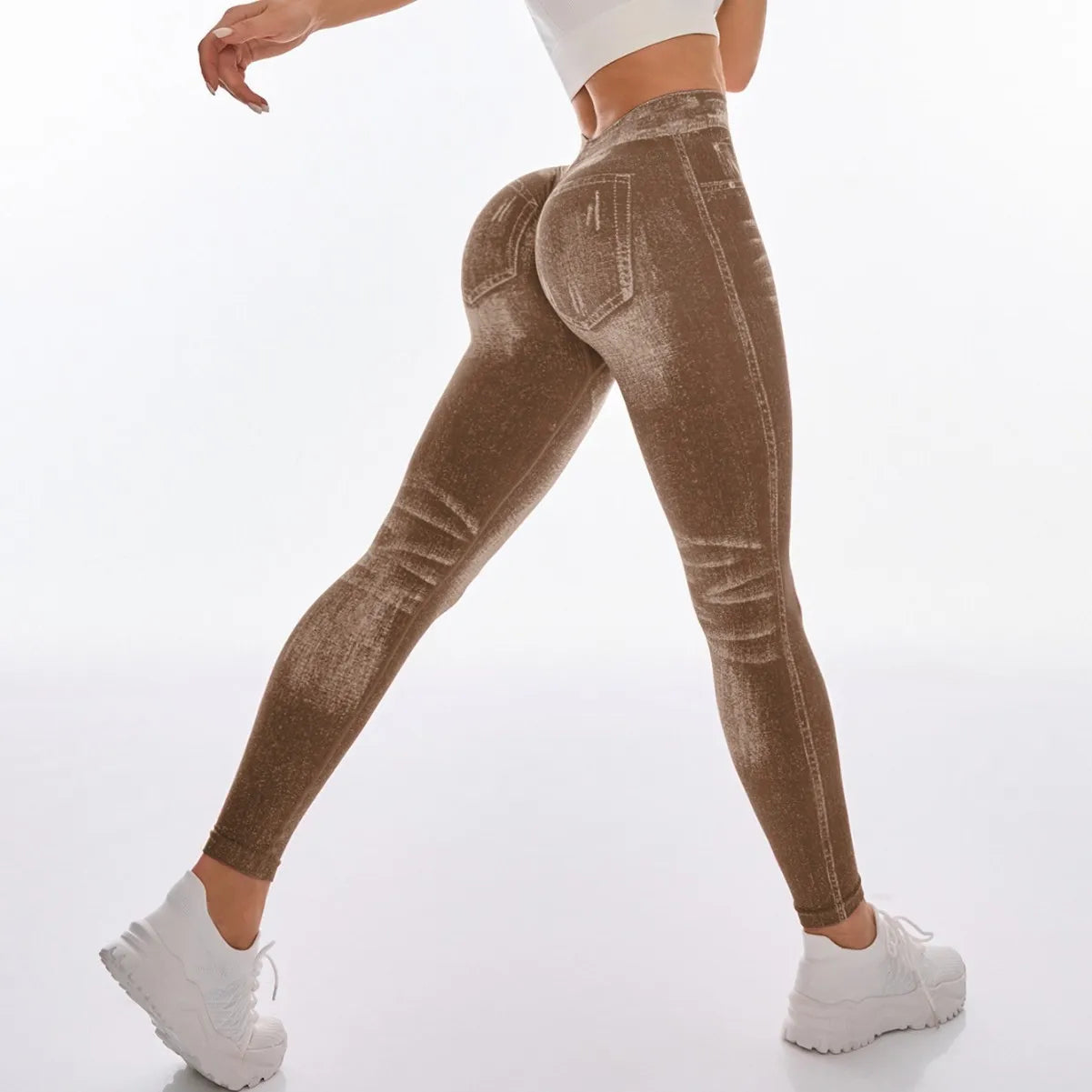 Brown leggings worn by a person on a white background