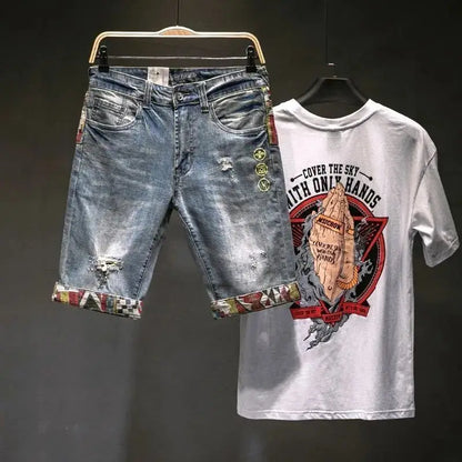 Denim shorts and a white t-shirt with graphic design on a dark background
