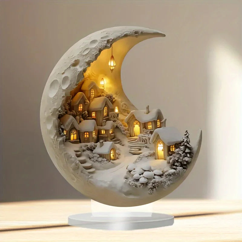 Decorative moon-shaped lamp with a village scene inside, glowing softly.