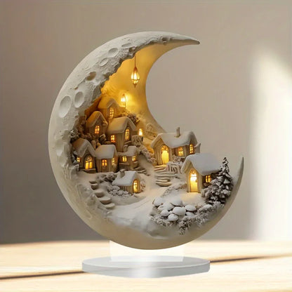 Decorative moon-shaped lamp with a village scene inside, glowing softly.