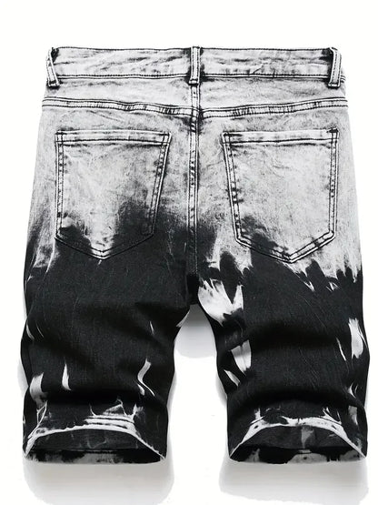 Black and white distressed denim shorts on a white background