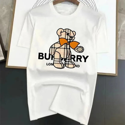 White t-shirt with a teddy bear graphic and 'Burberry' text on a plain background