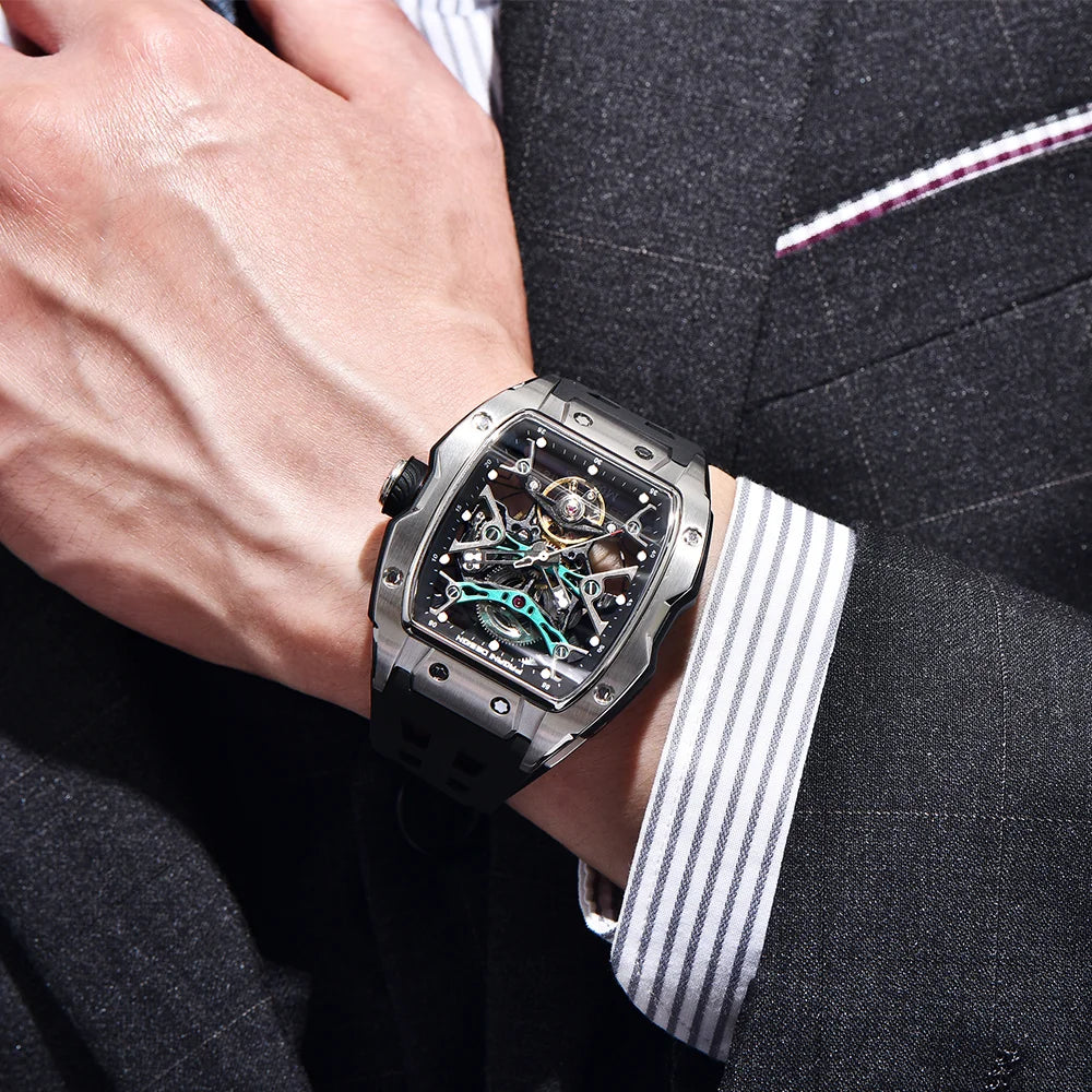 Luxury watch on a person's wrist with a suit background