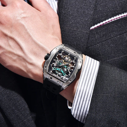 Luxury watch on a person's wrist with a suit background