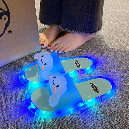 Glowing LED slippers with snowman design on a carpeted floor.