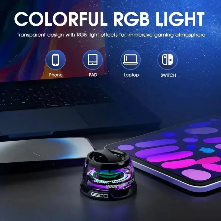 Transparent device with RGB light effects on a desk, surrounded by electronic devices.