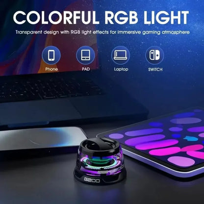 Transparent device with RGB light effects on a desk, surrounded by electronic devices.