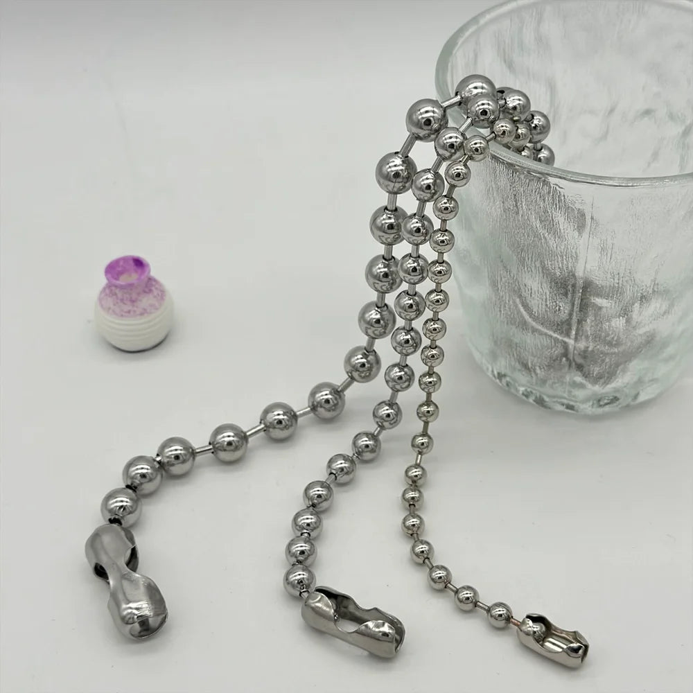 Metallic chain with clasp on a white surface