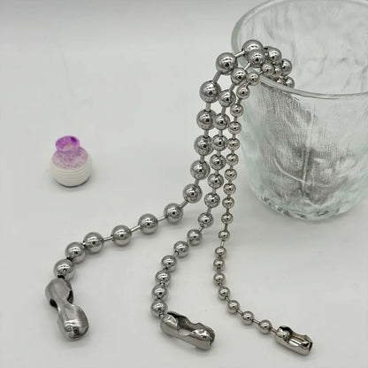 Metallic chain with clasp on a white surface