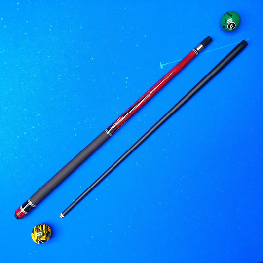 A split-length pool cue shown on a bright blue background, with one half in matte black and the other in red with silver metal accents. A striped yellow and black cue ball and a green cue ball are placed near the top right.