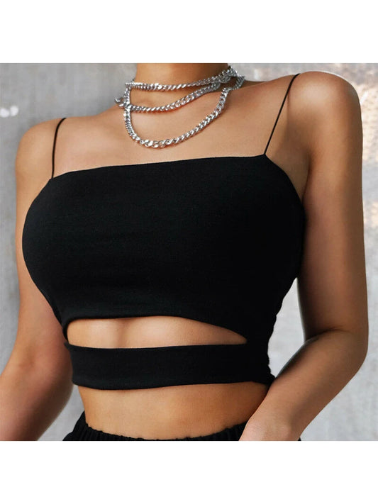 Black crop top with cut-out design worn by a person, against a neutral background