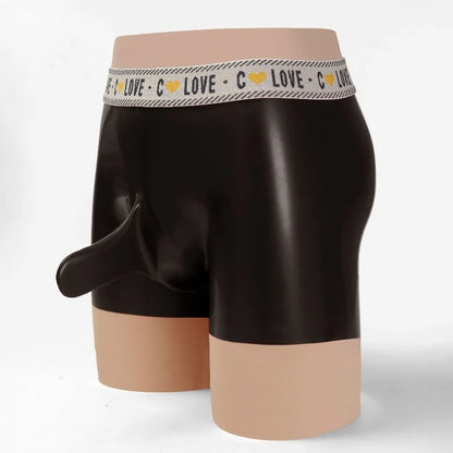 Black boxer briefs with a beige waistband on a mannequin against a white background