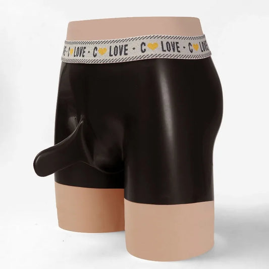 Black boxer briefs with a beige waistband on a mannequin against a white background