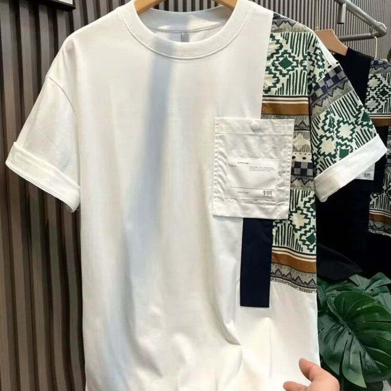 White t-shirt with patterned sections on a hanger