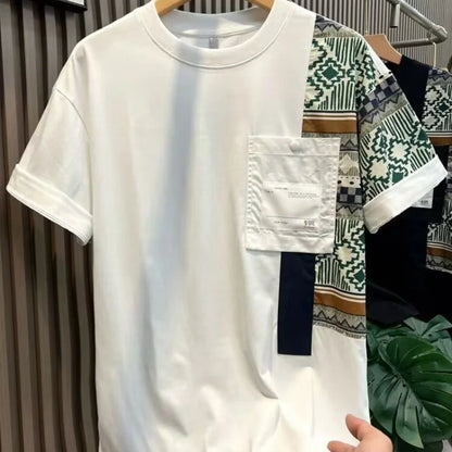 White t-shirt with patterned sections on a hanger