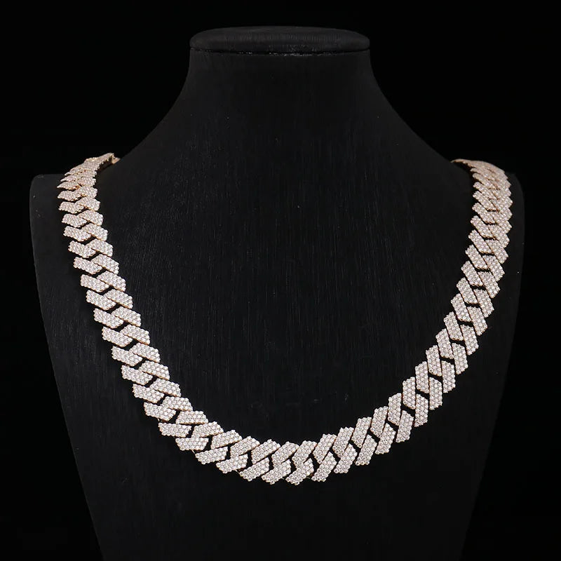 Gold chain necklace on a black mannequin bust