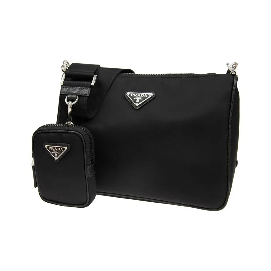 Black Prada handbag with matching pouch on a white background