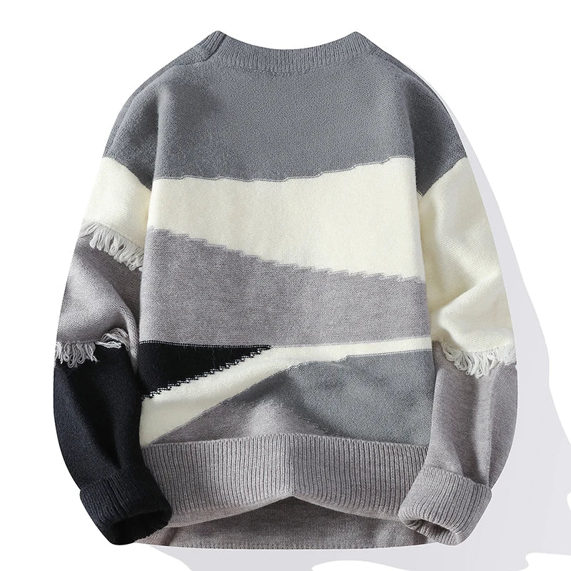 Gray and white striped sweater with frayed edges on a white background